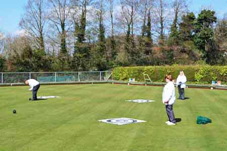 painting of bowlers on the green