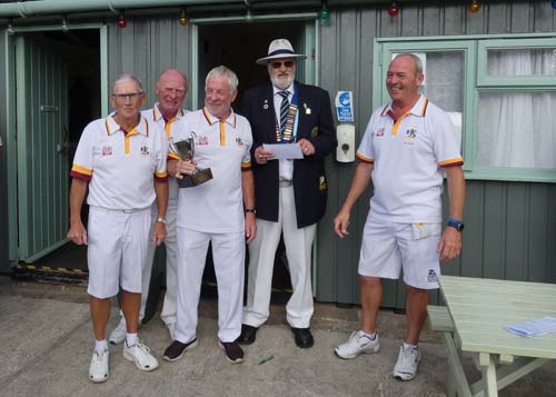 4 Paignton bowlers with a cup.