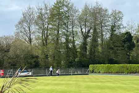 two ladies on green.